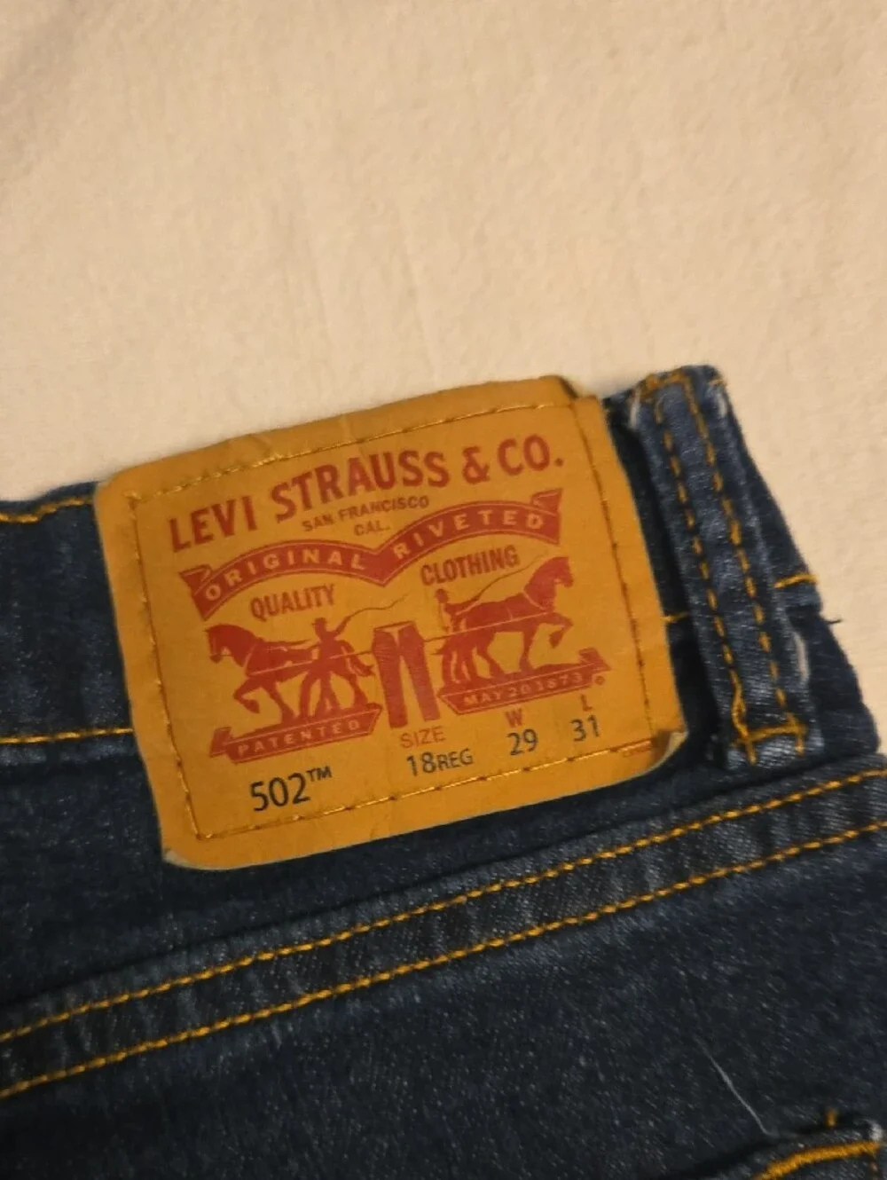 Levi's Men's 502 Jeans in Dark Indigo with Gold Stitching